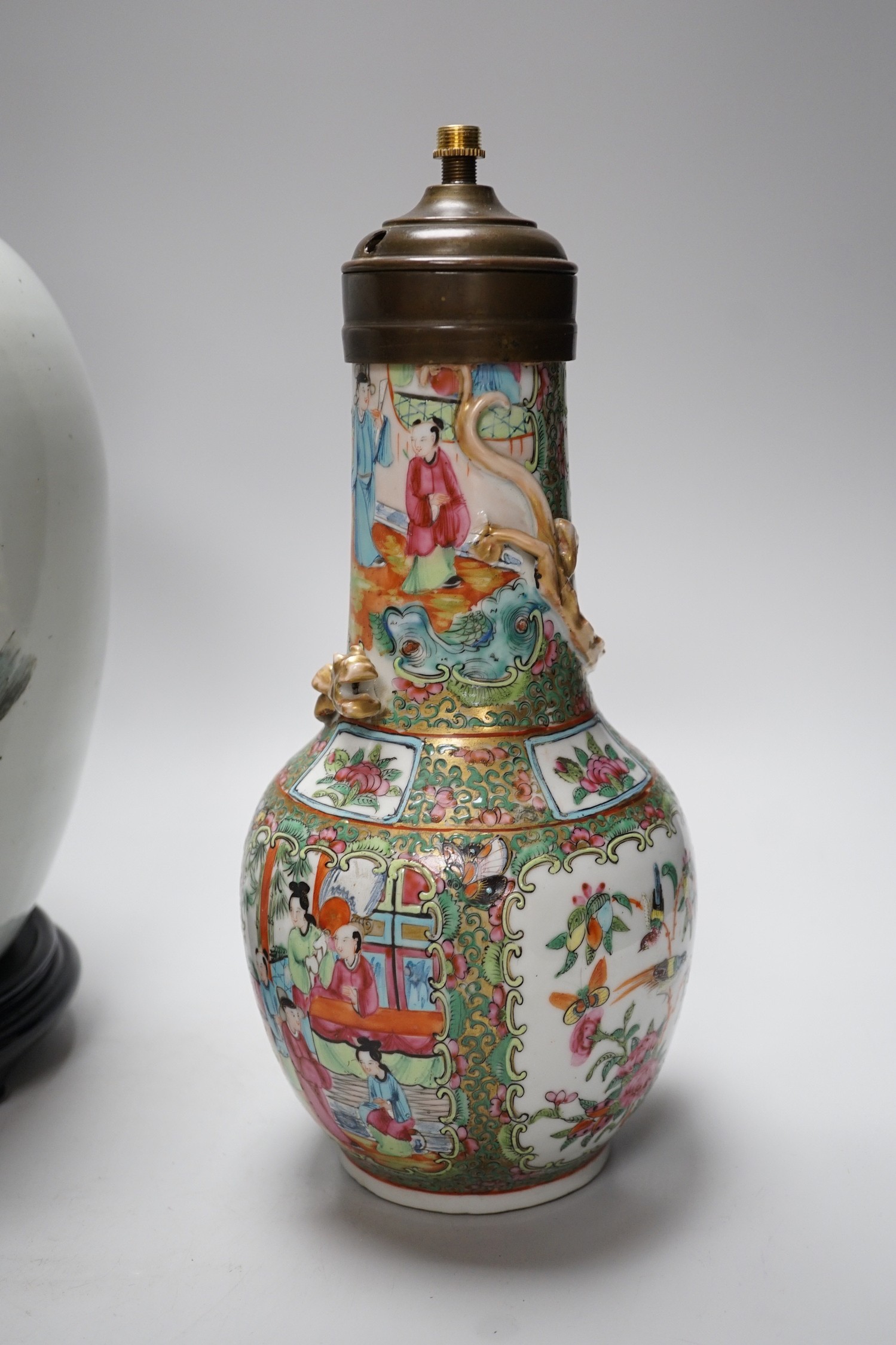 A Chinese famille rose vase converted to a lamp, 26cm, and a larger Chinese vase/lamp base, on stand, 41cm high